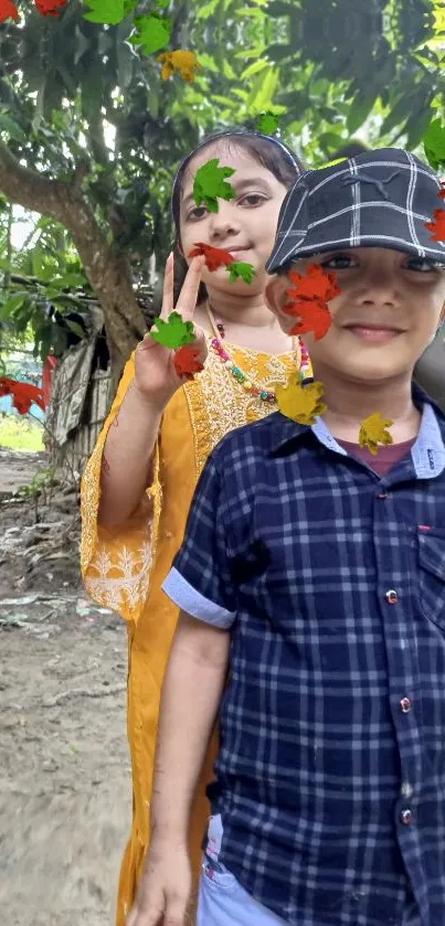 Kids having fun outdoors beneath colorful autumn leaves.