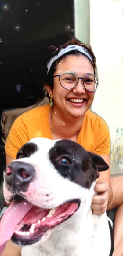 Woman smiling with her cheerful dog close by in a bright, vibrant setting.