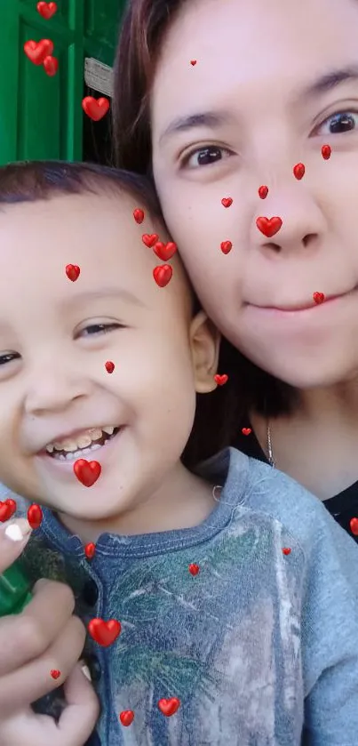 Mother and child smiling with red hearts overlay.