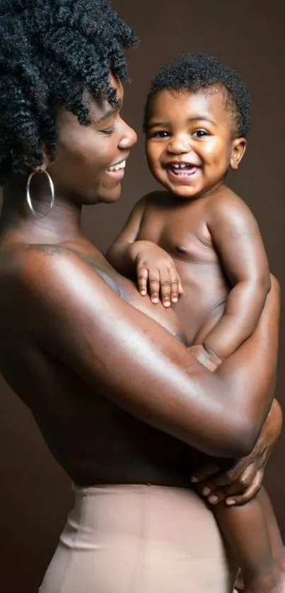 Mother holding smiling baby, brown background wallpaper.