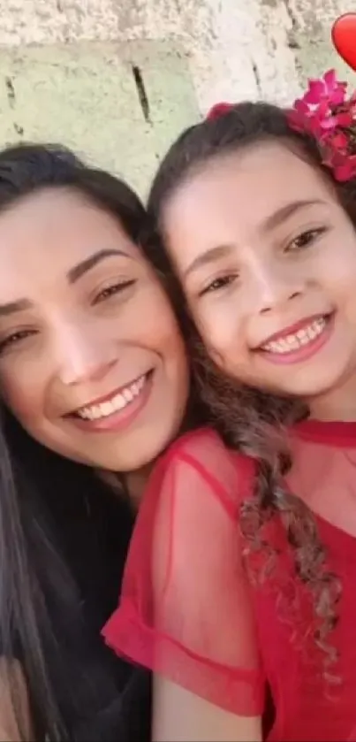 Mother and daughter smiling together with love.