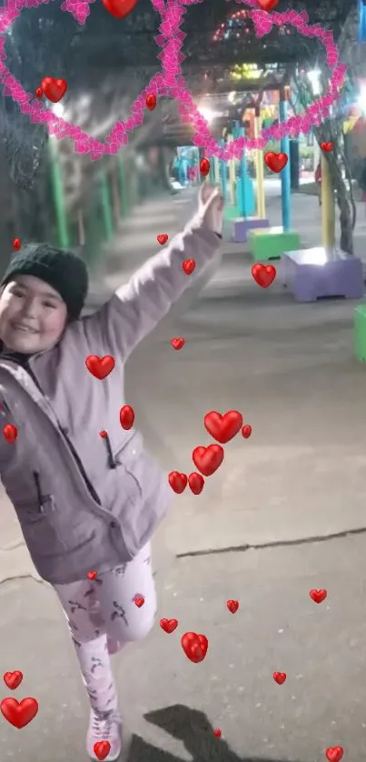 Smiling girl with hearts during night walk.