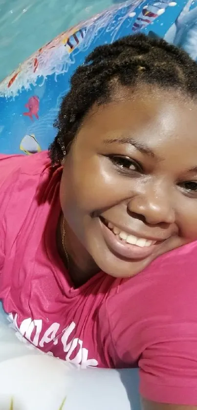 Smiling person enjoying a summer day on a pool float.