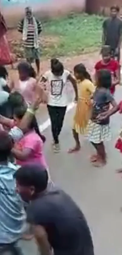 Children engage in joyful street dance celebration.