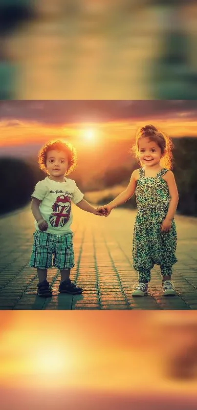 Two kids smiling, holding hands at sunset.