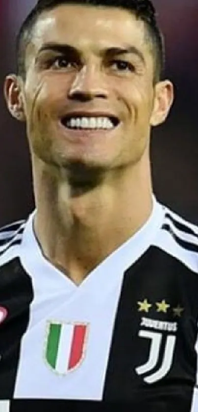 Famous Juventus player smiling in jersey.