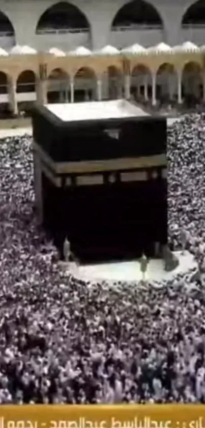 Aerial view of the Kaaba during pilgrimage in Mecca, surrounded by worshippers.