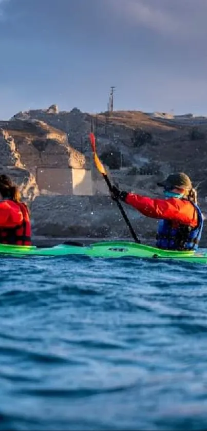 Kayakers paddling in blue waters against rocky cliffs.