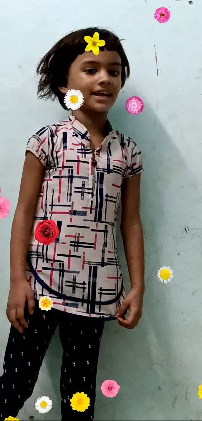 Cheerful child with floral decorations on a light blue background.