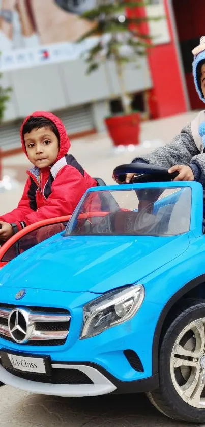 Kids in toy cars enjoying playful outdoor fun.