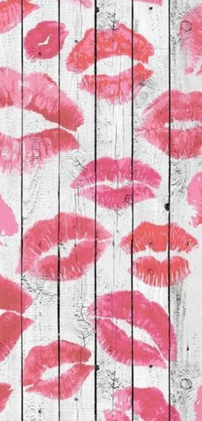 Pink lipstick prints on white wooden background wallpaper.