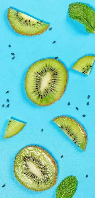 Vibrant wallpaper with kiwi slices and mint leaves on blue.