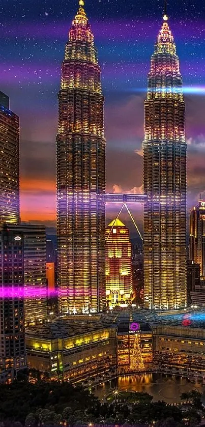Kuala Lumpur skyline at night with illuminated buildings and starry sky.