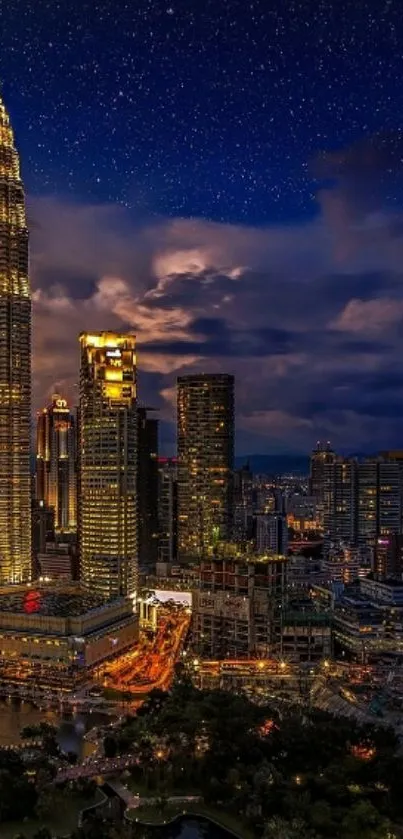 Kuala Lumpur skyline at night with illuminated buildings and starry sky.