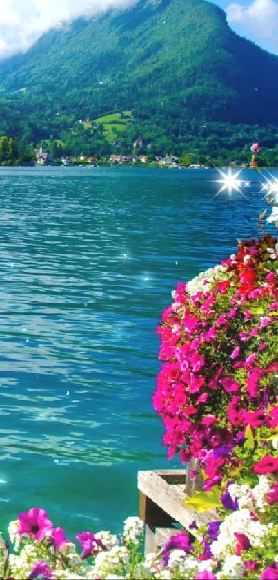 Vibrant mountain lake with colorful flowers in foreground.