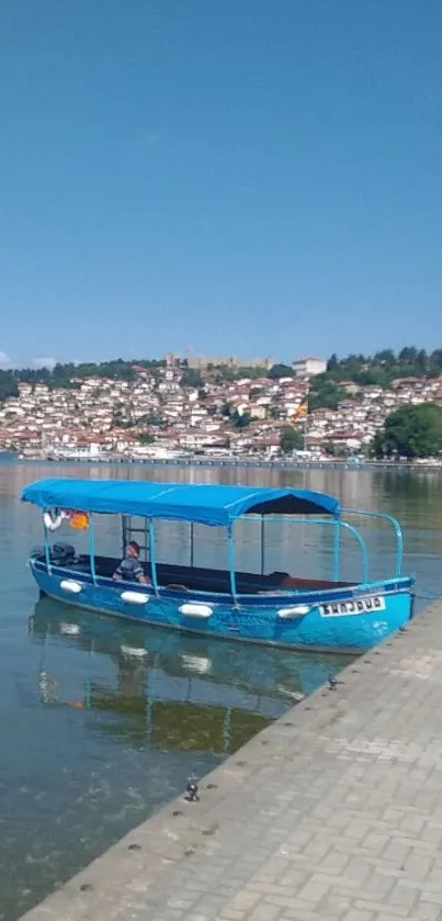 A peaceful blue boat on a lake with a scenic cityscape background.