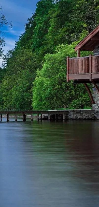 Rustic cabin by a tranquil lakeside with lush greenery and blue sky.
