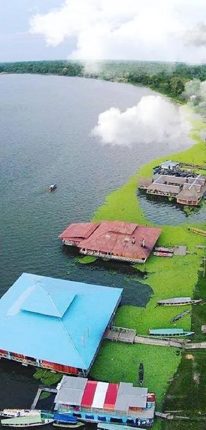 Aerial view of a lakeside village with green landscape and waterfront homes.