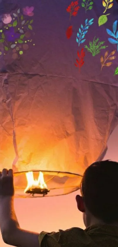 Boy releasing glowing lantern with floral art.