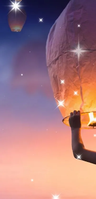 Boy releasing sky lantern at sunset with glowing backdrop.