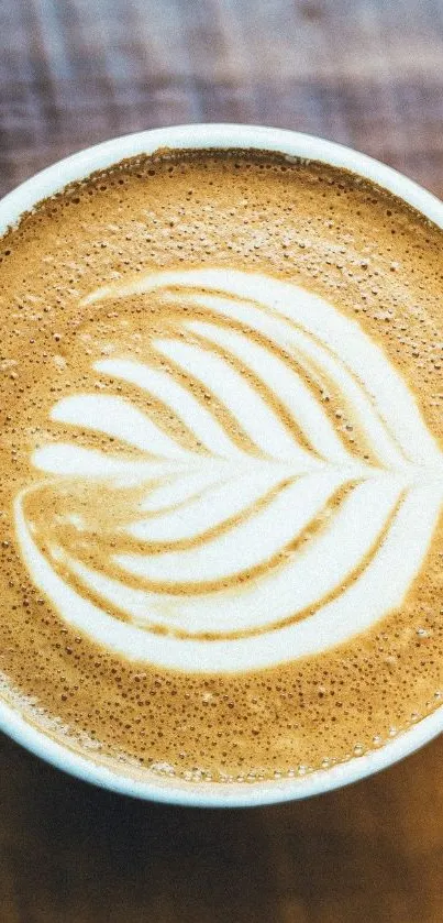 Close-up of latte art in a coffee cup on a textured surface.