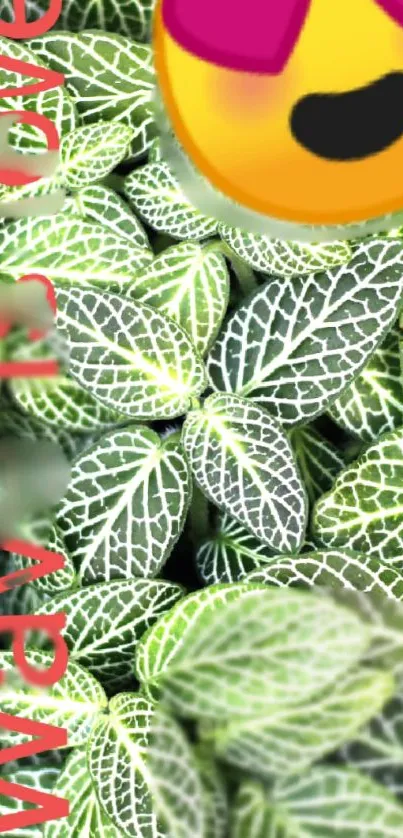 Leafy green wallpaper with heart-eyed emoji overlay.