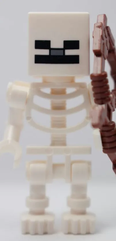 LEGO skeleton holding a brown bow.