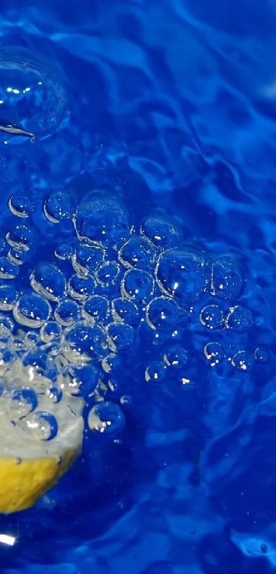 Lemon slice creating splash in vibrant blue water.