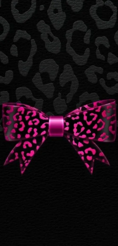 Leopard print with pink bow on black background wallpaper.