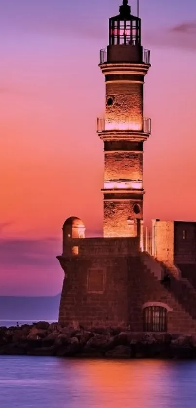 Sunset lighthouse reflecting in ocean.