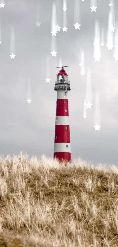 Red and white lighthouse with dune grass under a cloudy sky.