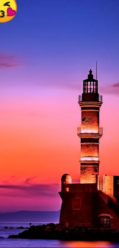 Lighthouse at sunset with vibrant orange and purple skies.