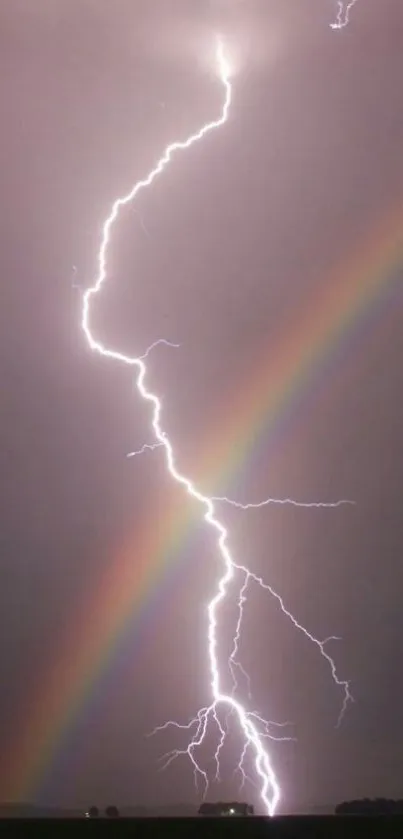 Lightning bolt strikes through colorful rainbow against a grey sky.