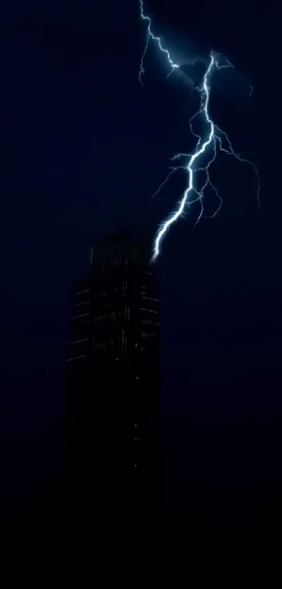 Lightning illuminates a dark tower at night.