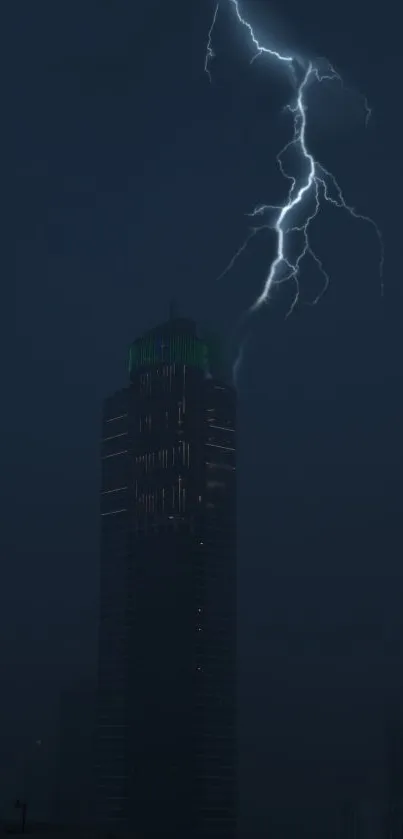 Lightning striking a skyscraper at night with a dark blue background.