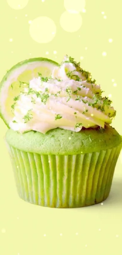 Bright lime cupcake with creamy frosting on pastel background.