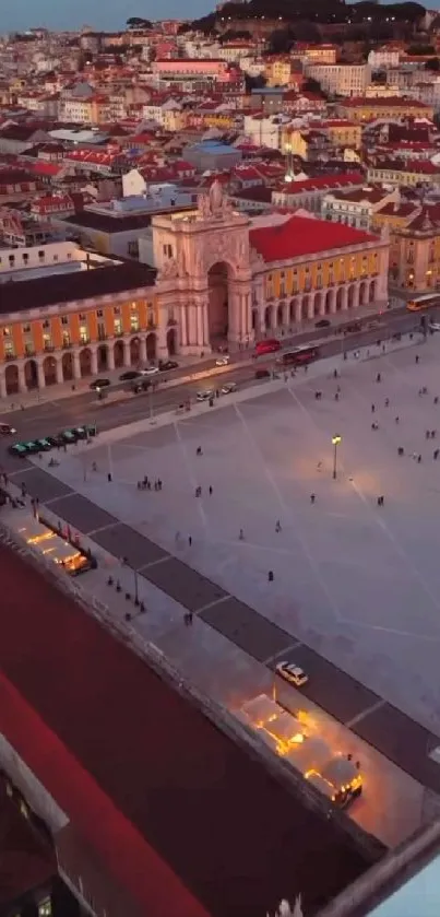 Aerial view of Lisbon showcasing Praça do Comércio at dusk, vibrant cityscape wallpaper.