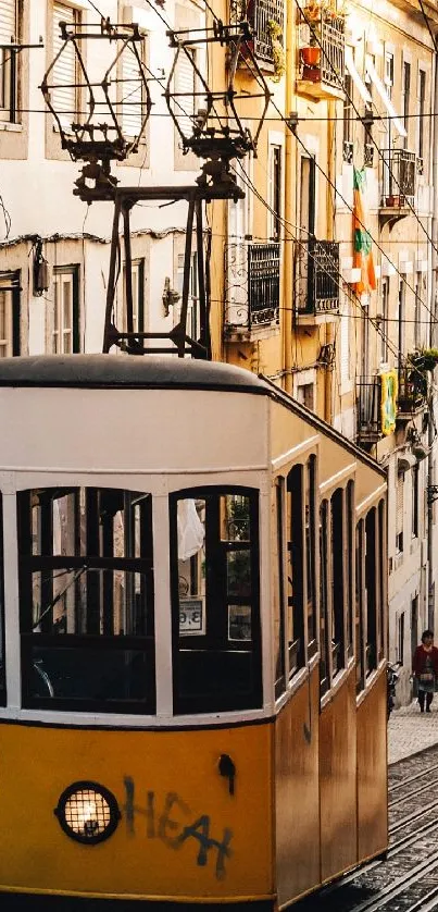 Lisbon's iconic yellow tram on a historic cobbled street.