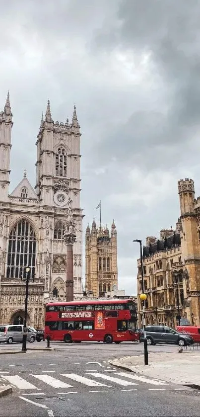 London street view with historic buildings and red bus under a gray sky.