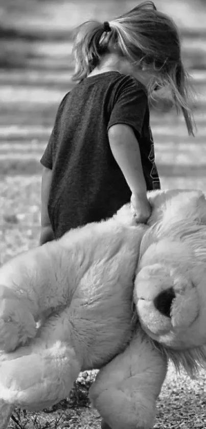 Child walking holding a large plush lion in grayscale.