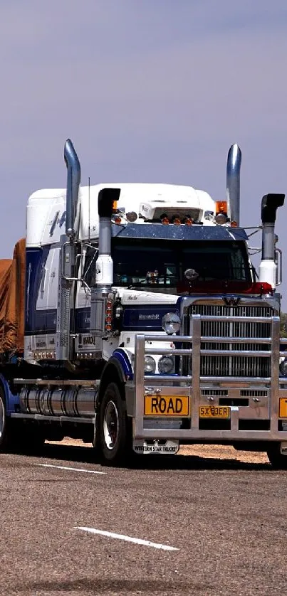 Australian outback road train under clear sky.