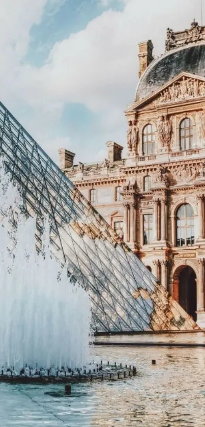 Louvre Pyramid with fountain in Paris as mobile wallpaper.