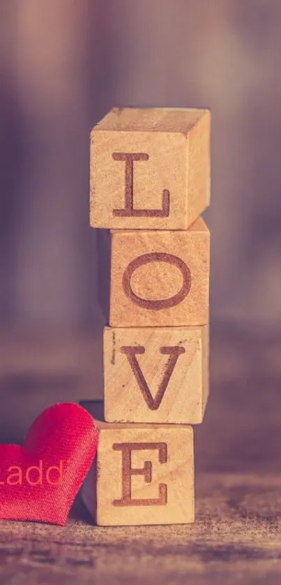 Mobile wallpaper with wooden blocks spelling 'LOVE' and a red heart.