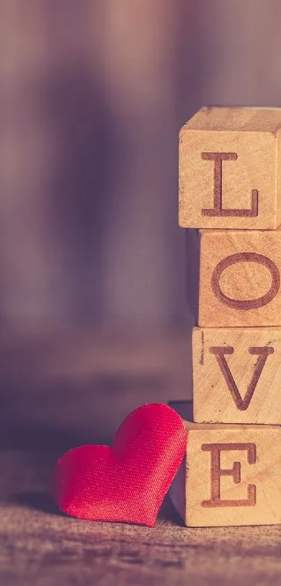 Love spelled with wooden blocks and a red heart.