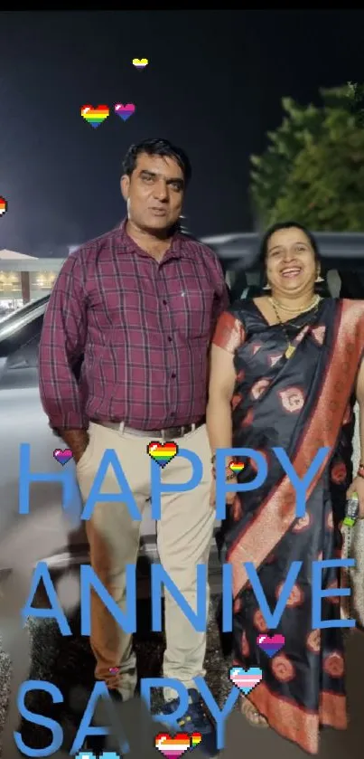 Couple celebrates anniversary with colorful hearts and text overlay.