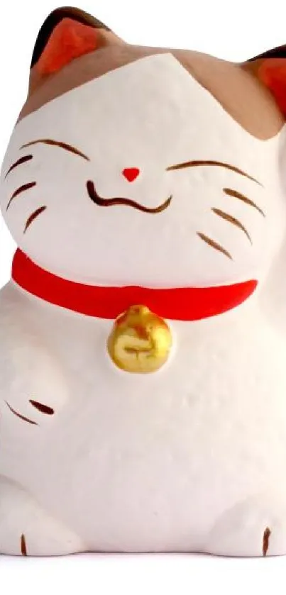 Charming lucky cat figurine with red collar and golden bell on a white background.