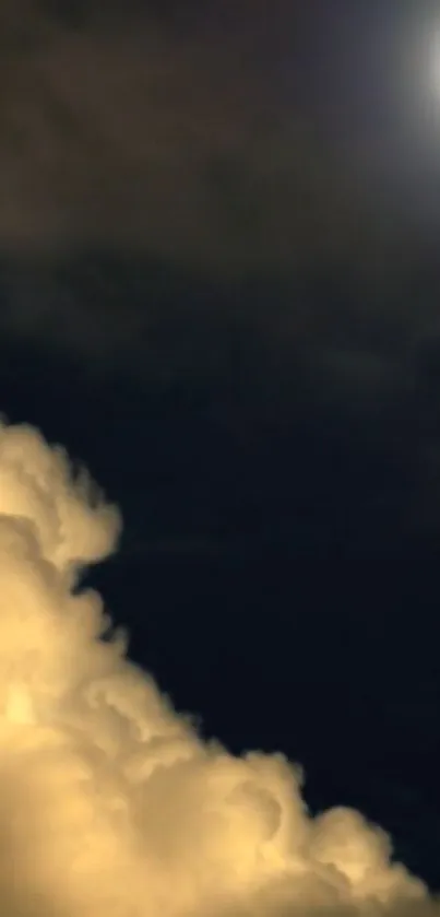 Serene night sky with a glowing moon and illuminated clouds.