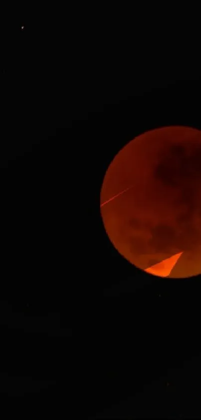 Stunning red moon during a lunar eclipse in the night sky.