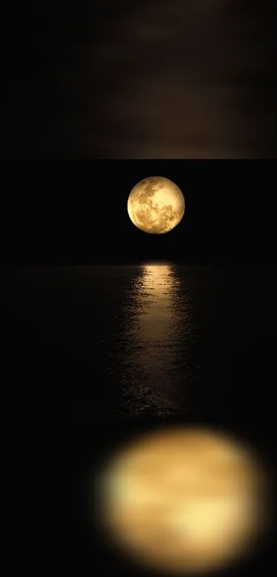 Serene full moon reflecting on a dark ocean at night.