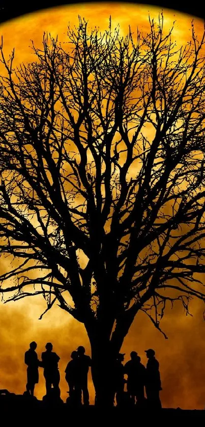 Silhouette tree against a full moon with starry night sky.
